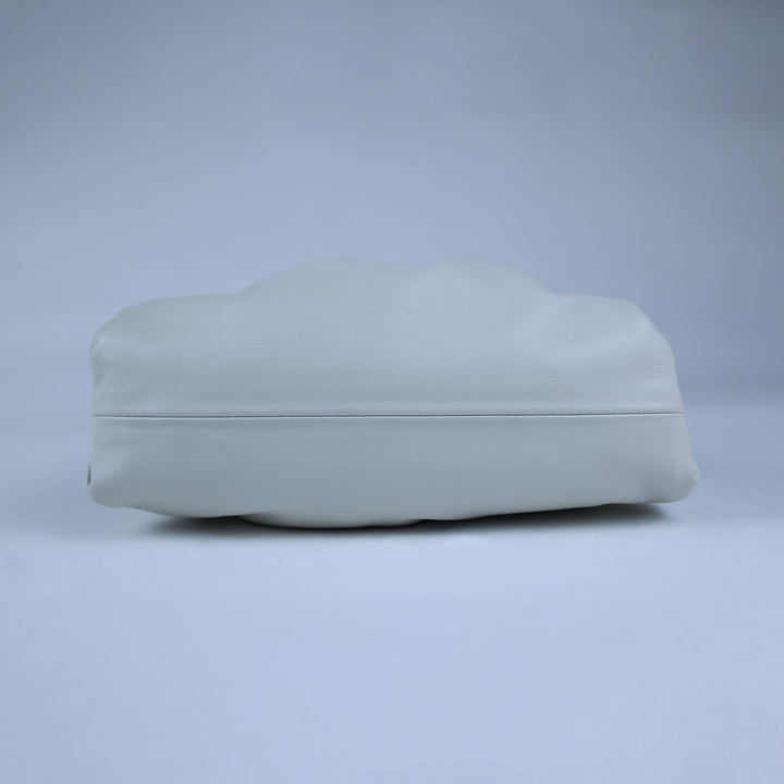 Light gray cushion on a matching light gray background