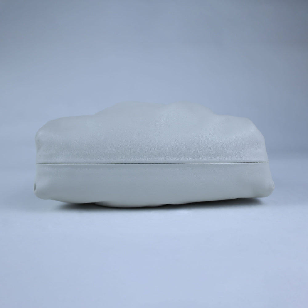 Light gray cushion on a matching light gray background